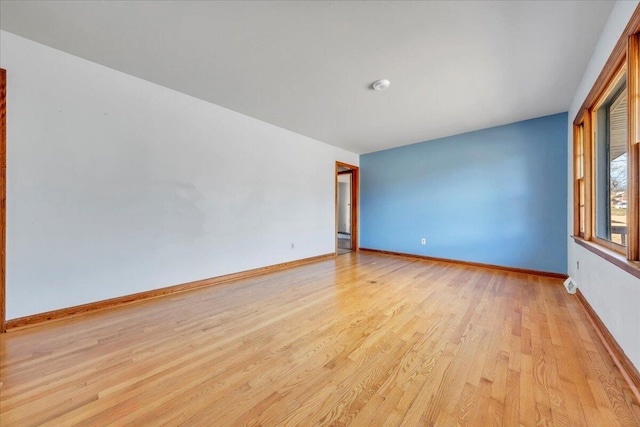 unfurnished room featuring light wood-type flooring