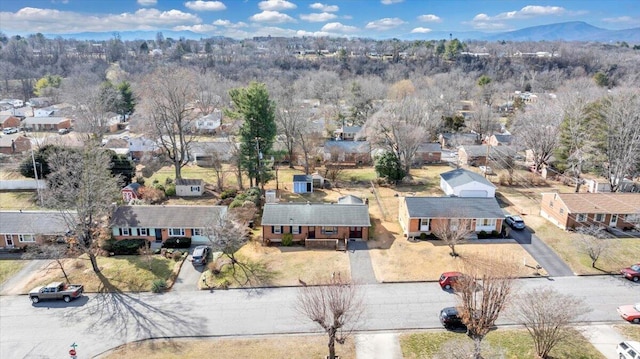 birds eye view of property featuring a mountain view