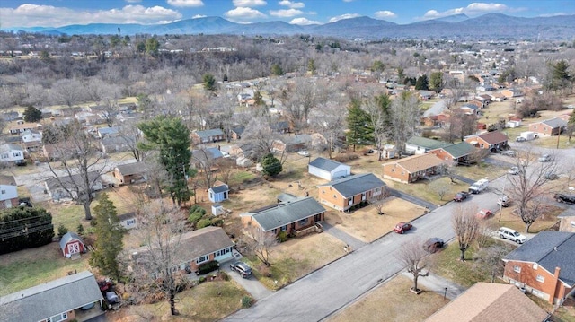 birds eye view of property featuring a mountain view