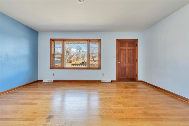 unfurnished room featuring light wood-type flooring