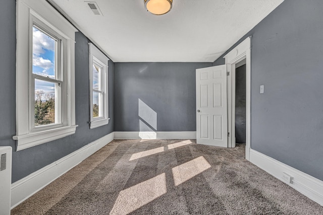 spare room with carpet