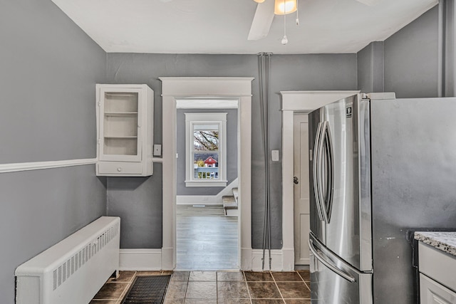 washroom featuring radiator heating unit and ceiling fan