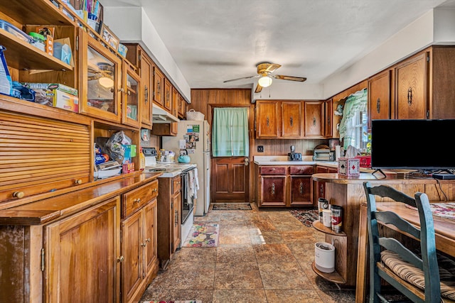 kitchen featuring ceiling fan and white range with electric stovetop