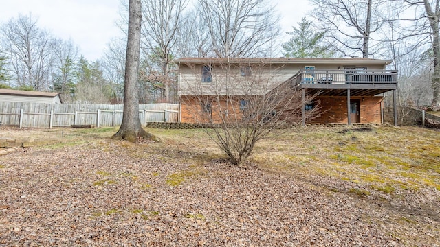 rear view of property with a wooden deck