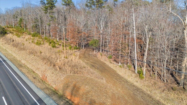 aerial view featuring a wooded view