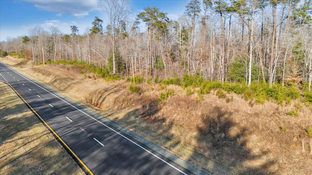 view of road featuring a view of trees