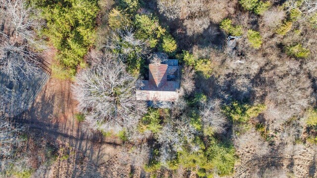 birds eye view of property with a view of trees