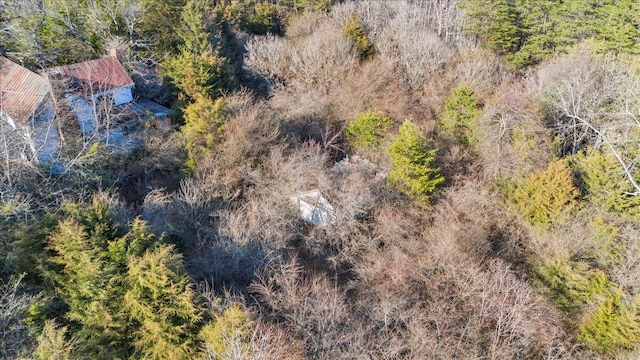 drone / aerial view featuring a forest view