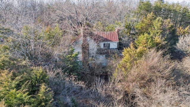 bird's eye view featuring a view of trees