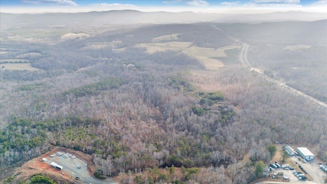 aerial view featuring a mountain view and a forest view