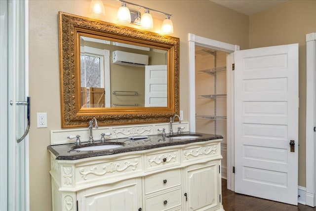 bathroom with vanity and an AC wall unit