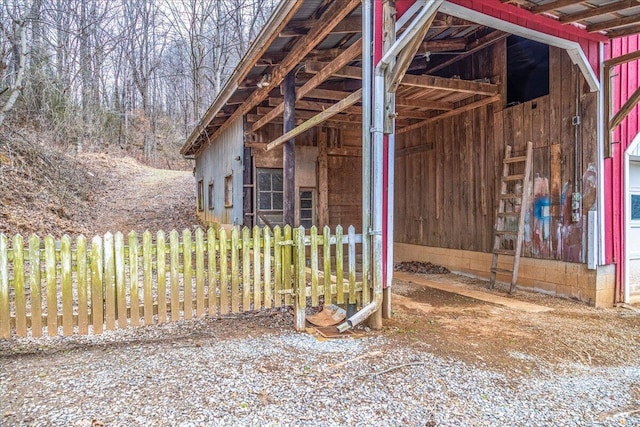 view of property exterior with an outbuilding