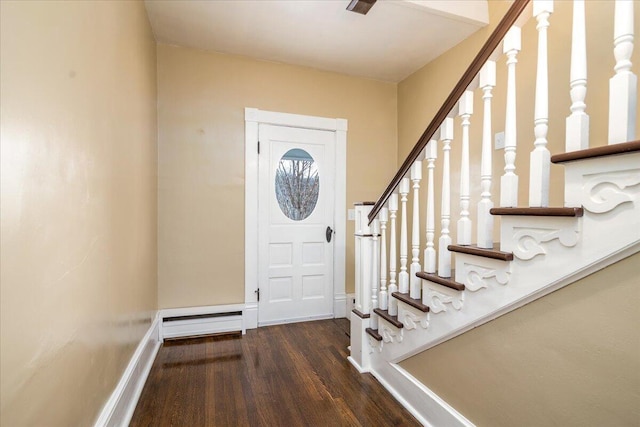 entrance foyer with dark wood-type flooring and a baseboard heating unit