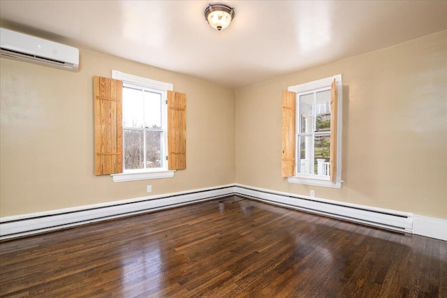 spare room with a baseboard radiator, wood-type flooring, and a wall mounted AC