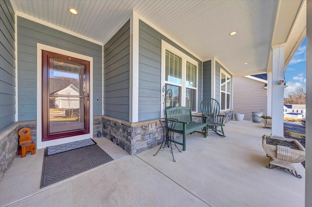 entrance to property featuring a porch