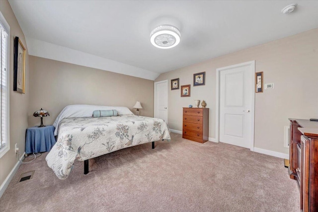 bedroom featuring vaulted ceiling and carpet floors