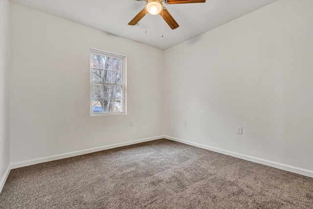 spare room with carpet flooring and ceiling fan