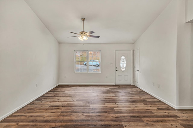 foyer with vaulted ceiling, dark hardwood / wood-style floors, and ceiling fan