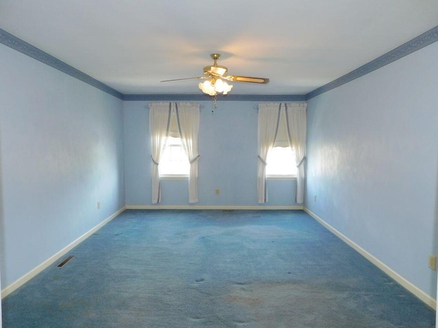 unfurnished room with ceiling fan, ornamental molding, carpet floors, and a wealth of natural light