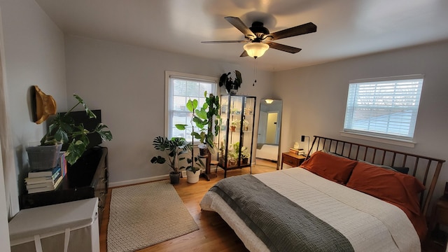 bedroom featuring ceiling fan and light hardwood / wood-style floors