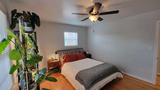 bedroom featuring ceiling fan and light wood-type flooring