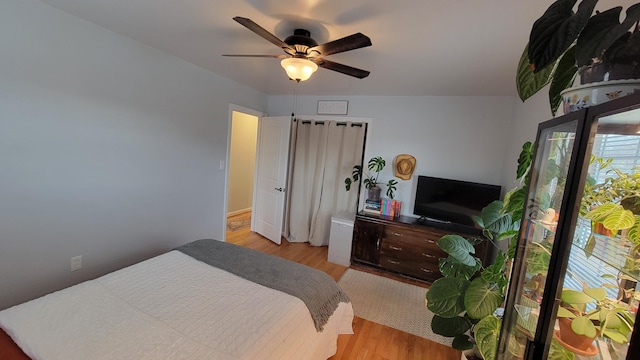 bedroom featuring ceiling fan and light wood-type flooring