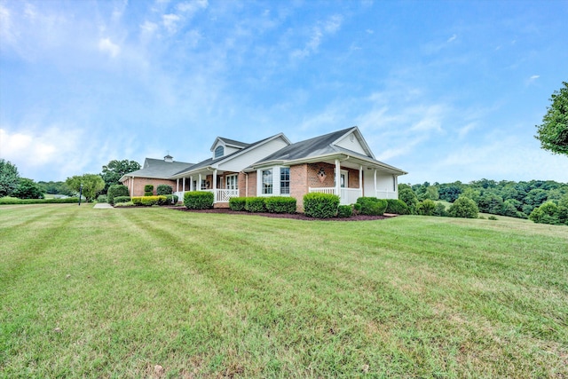 view of front facade with a front yard and a porch