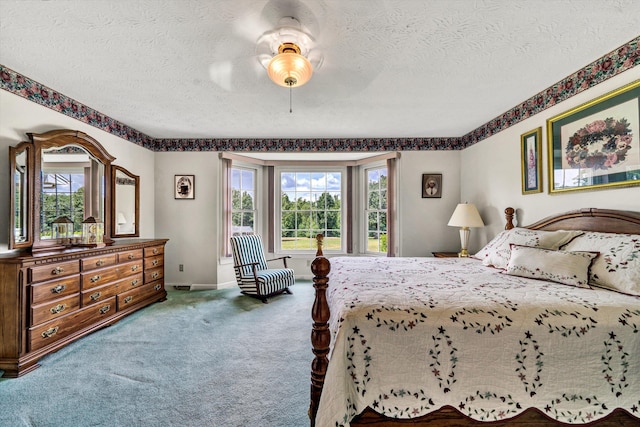 bedroom featuring carpet, a ceiling fan, a textured ceiling, access to outside, and baseboards