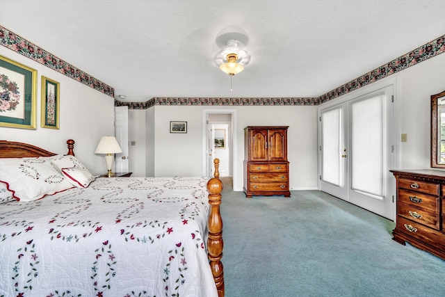 carpeted bedroom with access to outside and a textured ceiling