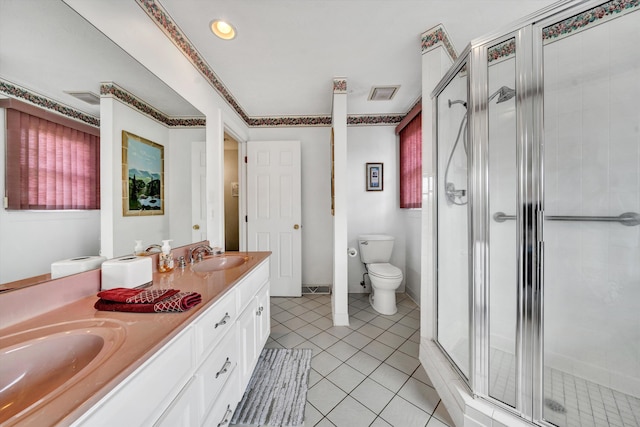 bathroom with tile patterned flooring, a sink, visible vents, a shower stall, and double vanity