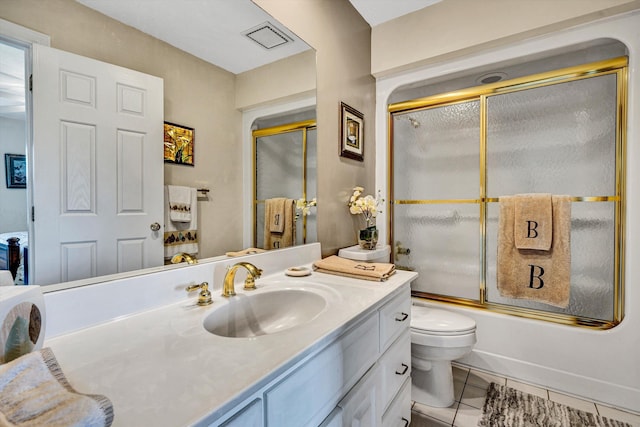 bathroom featuring tile patterned flooring, toilet, bath / shower combo with glass door, visible vents, and vanity