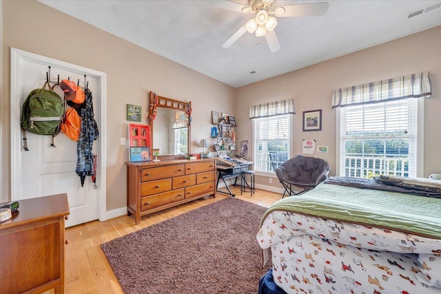 bedroom with ceiling fan and light hardwood / wood-style floors