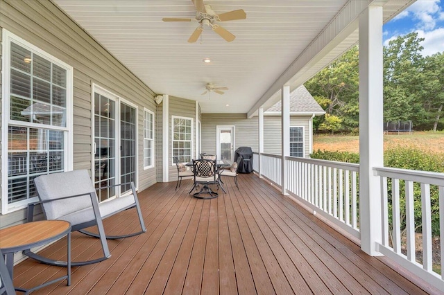 deck featuring a grill and ceiling fan