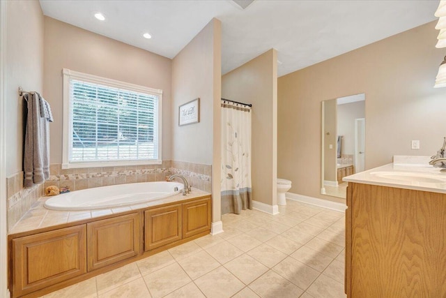 bathroom with tile patterned flooring, vanity, a washtub, and toilet