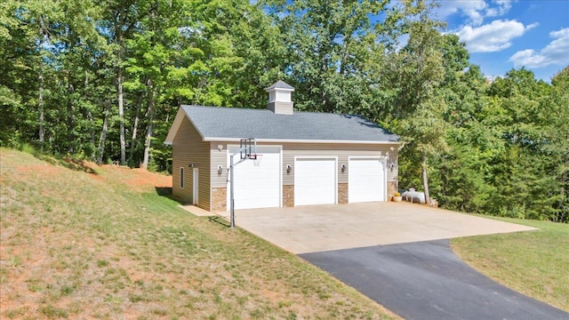 garage with a lawn