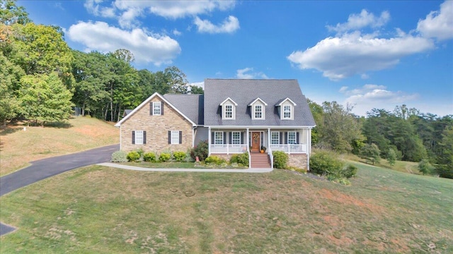 cape cod house with a front lawn and a porch