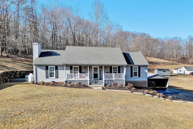 view of front of house featuring a front yard and covered porch