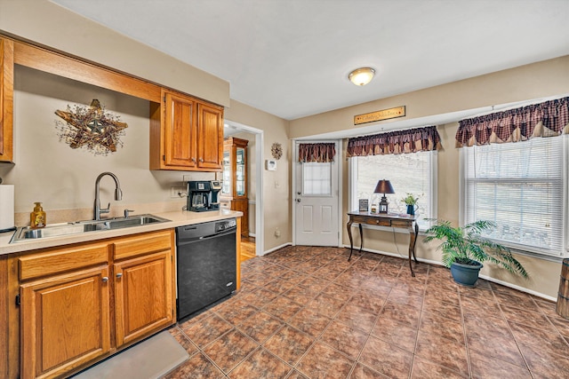 kitchen featuring black dishwasher and sink