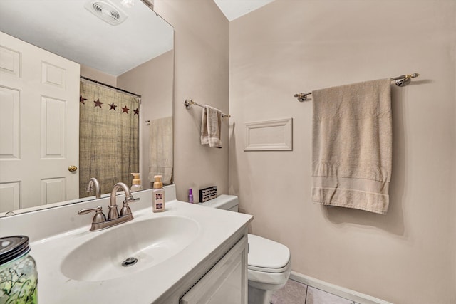 bathroom with vanity, curtained shower, tile patterned floors, and toilet