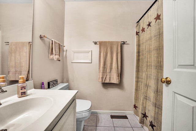 bathroom featuring tile patterned floors, toilet, curtained shower, and vanity