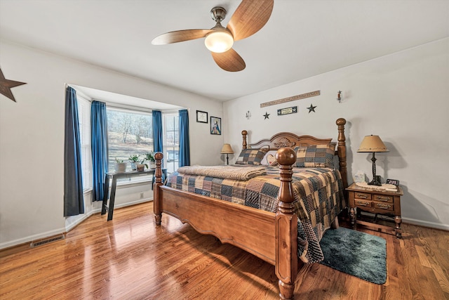 bedroom featuring ceiling fan and hardwood / wood-style floors