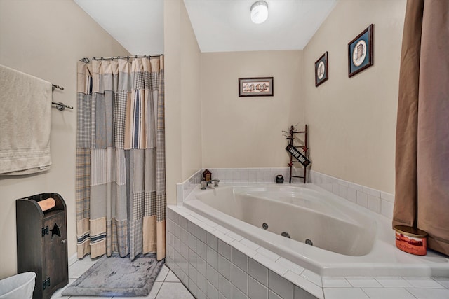 bathroom featuring tiled tub and tile patterned flooring