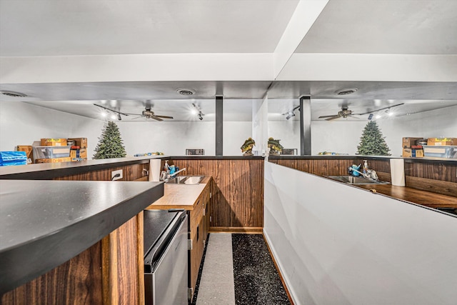 bar featuring dishwasher, sink, and ceiling fan