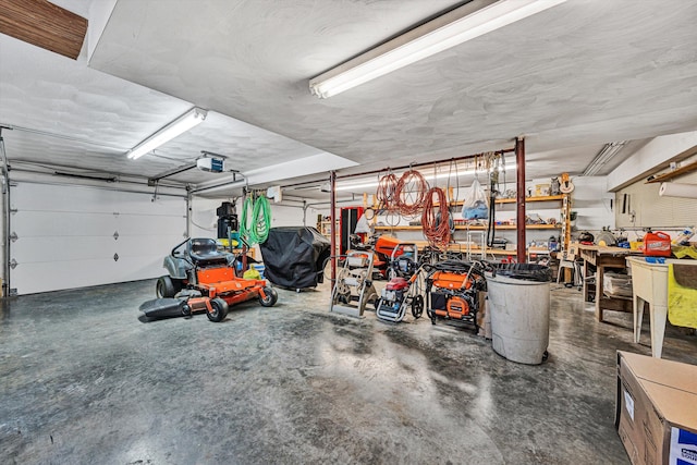 garage with a garage door opener and a workshop area