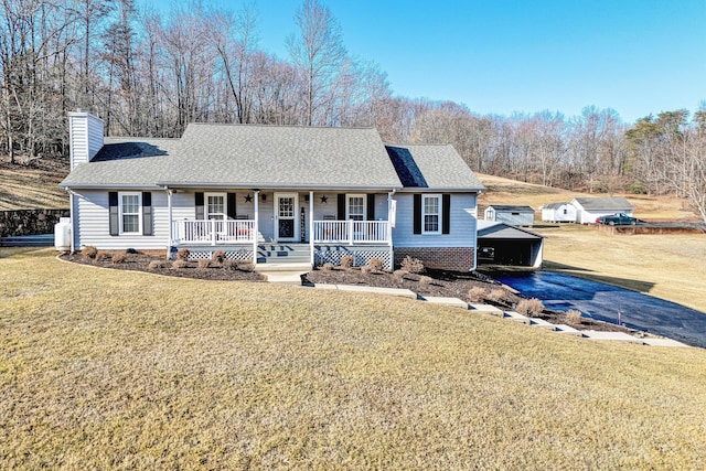 ranch-style house with a front yard and covered porch