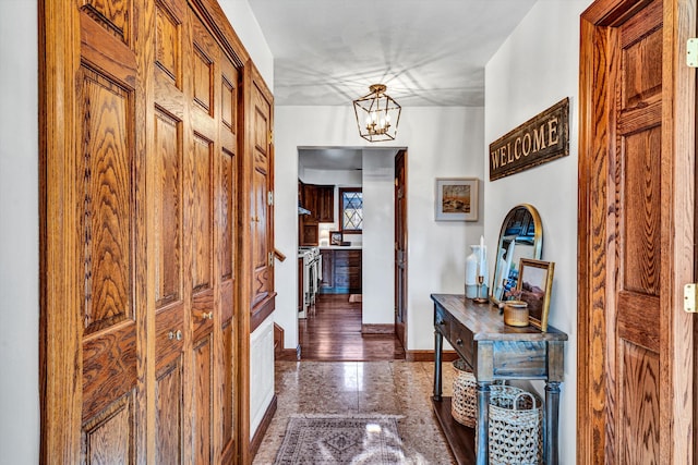 foyer entrance featuring an inviting chandelier