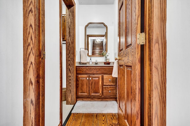 corridor featuring hardwood / wood-style flooring and sink