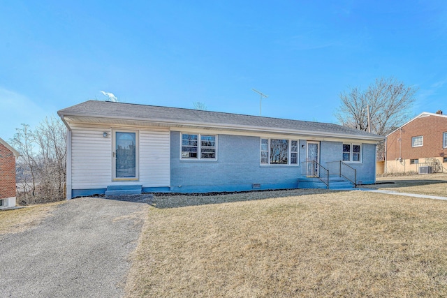 ranch-style house featuring central AC and a front yard