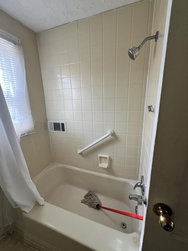 bathroom featuring shower / tub combo