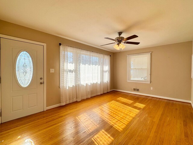 kitchen featuring light parquet flooring, stainless steel appliances, and sink